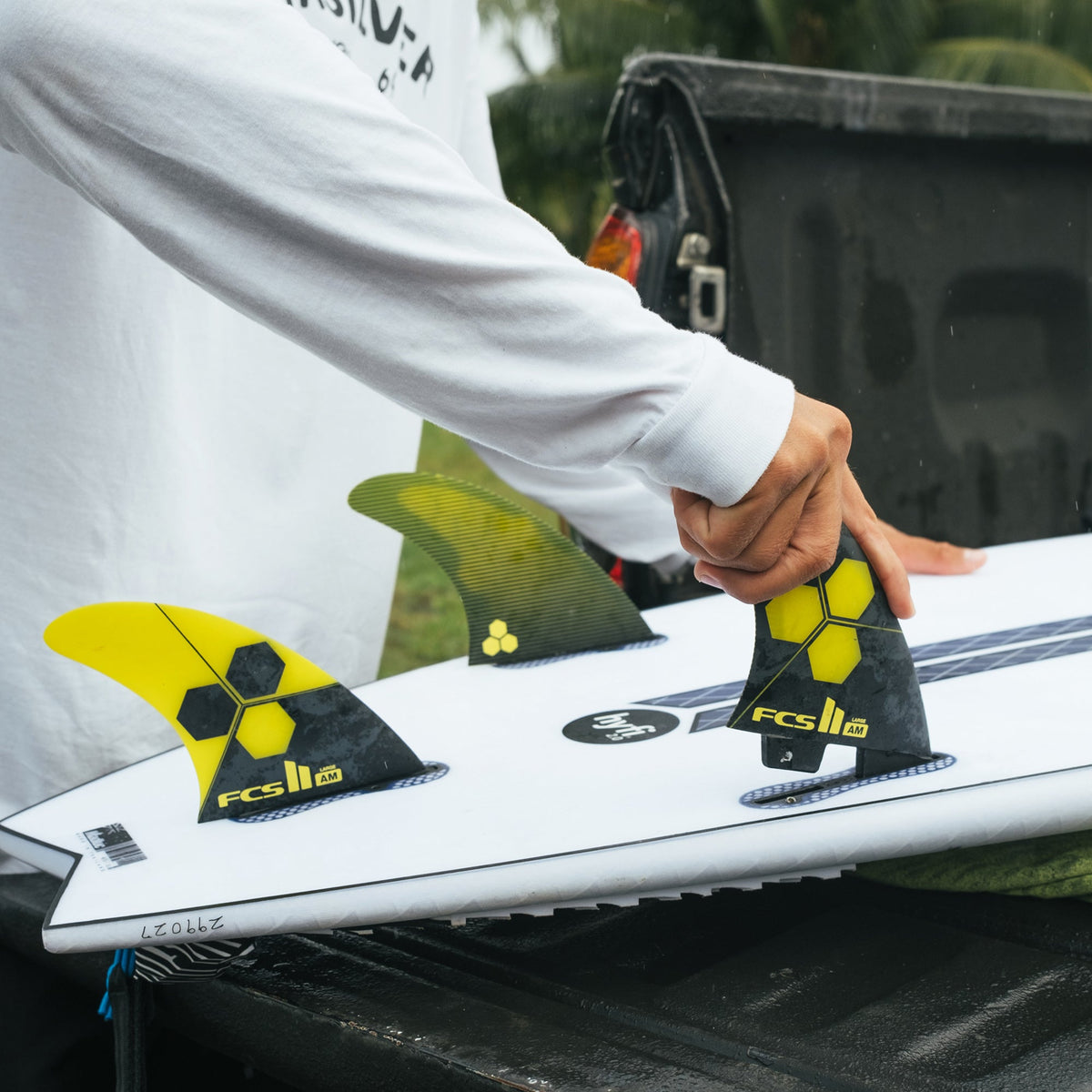FCS II Al Merrick PC Tri Fins fitted to a board