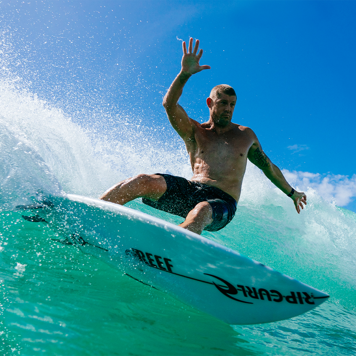 FCS II Mick Fanning PC Tri Fins Mick Fanning riding a wave