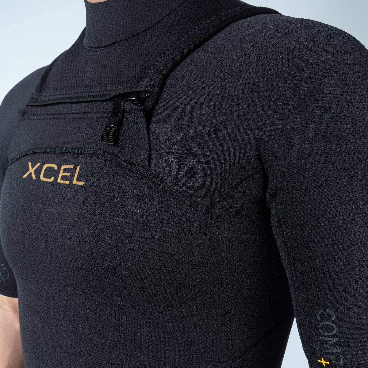 Xcel Mens Comp+ Short Sleeve Springsuit 2/1.5mm chest zip and Xcel logo close-up